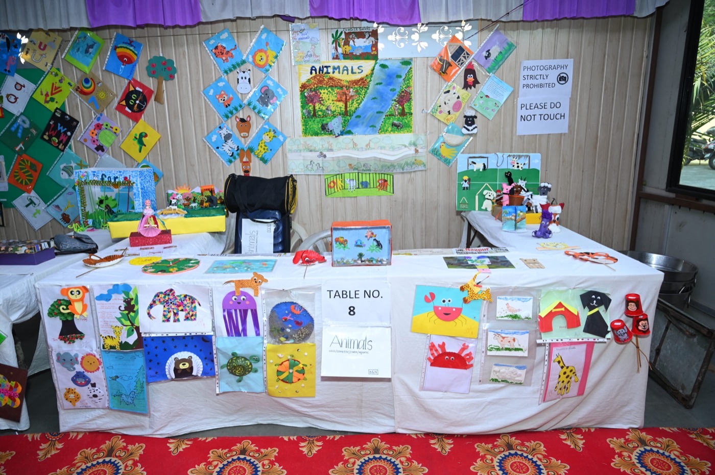 Handmade teaching aids on display at a student exhibition