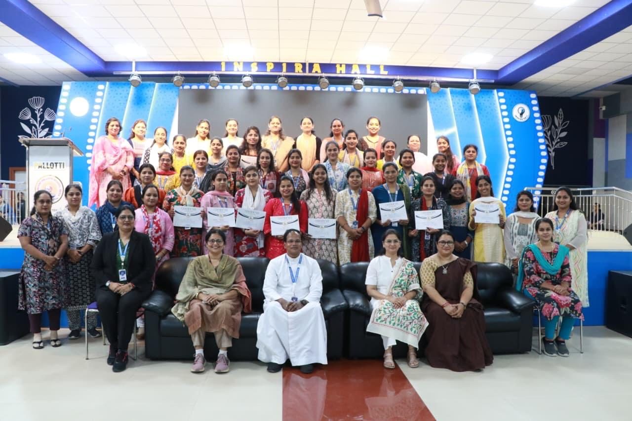 Trainee teachers and faculty on stage at a Toddler Teachers event